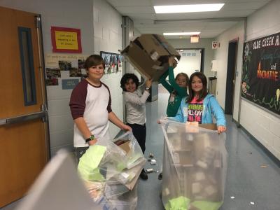 photo of students recycling