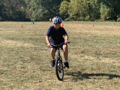 photo of a student riding a bike
