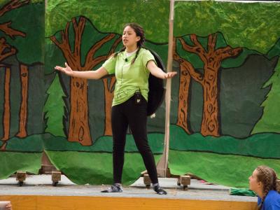 photos of students acting in the Play, "Tales from around the word"