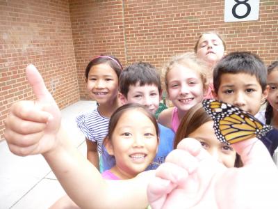 photo of students with butterflies