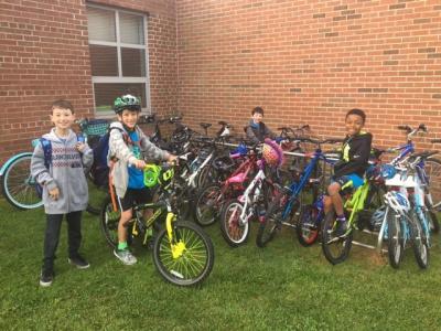 photo of students riding their bikes to school